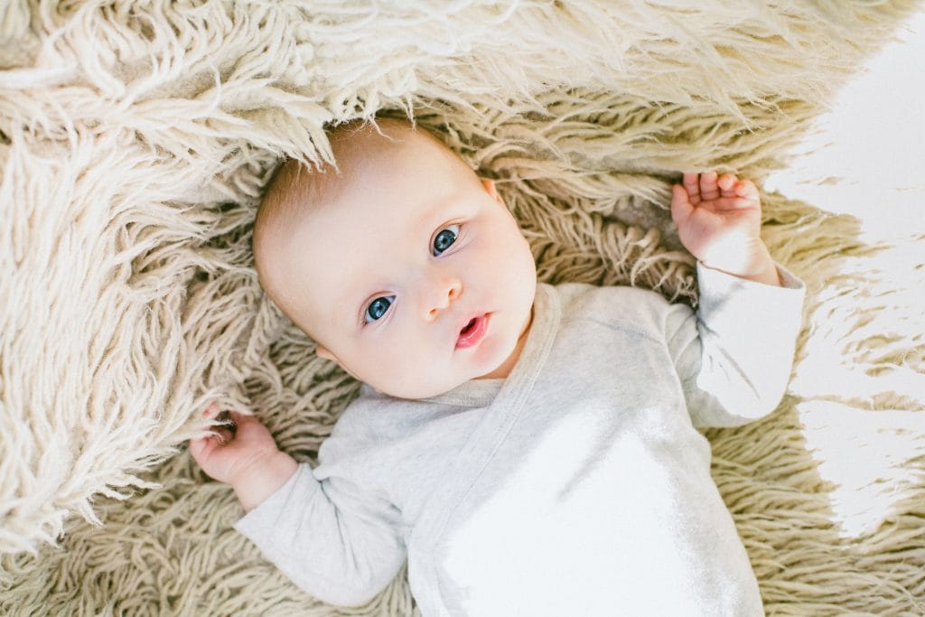 Cute baby on a soft blanket, New Parent Night March 7th