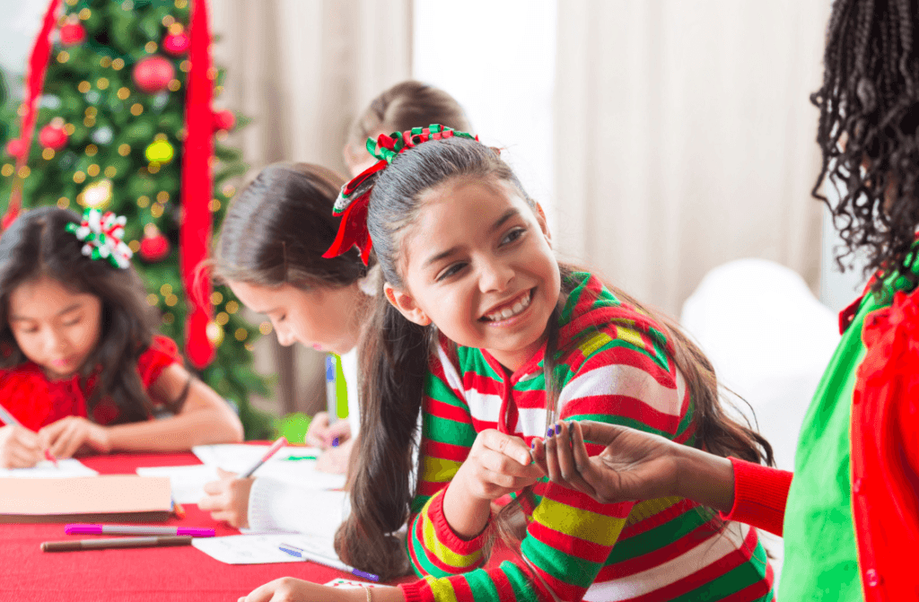 Less Holiday Stress, More Peace: Children drawing at holiday table with Christmas tree. Festive joy and creativity.